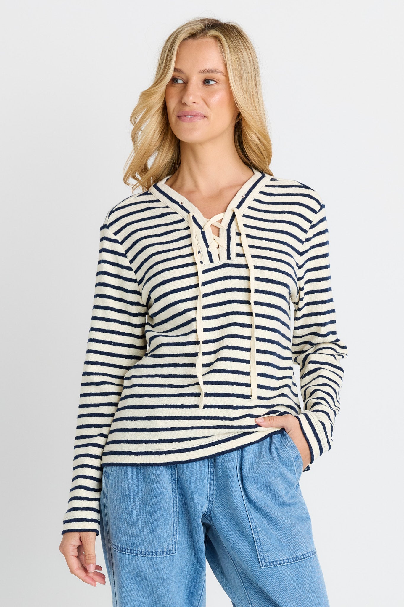 Image of a model wearing Tops. Product name - Tammi Tie Top Navy Stripe in Navy Stripe colour by brand - Betty Basics