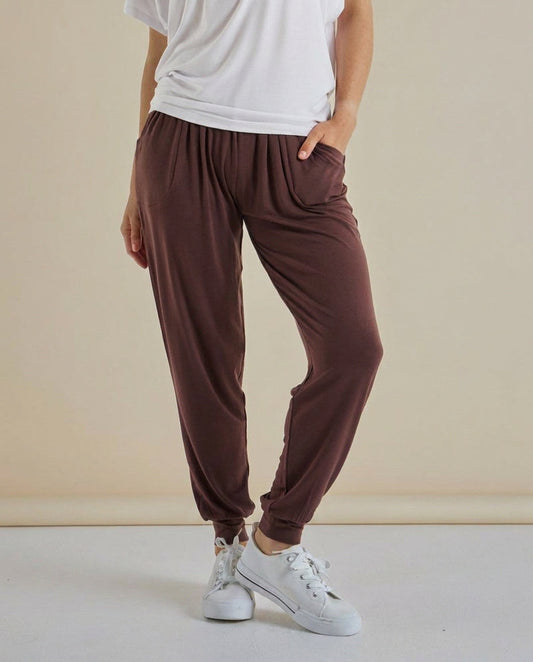 Image of a model wearing Pants. Product name - Paris Pant Nutmeg in Nutmeg colour by brand - Betty Basics