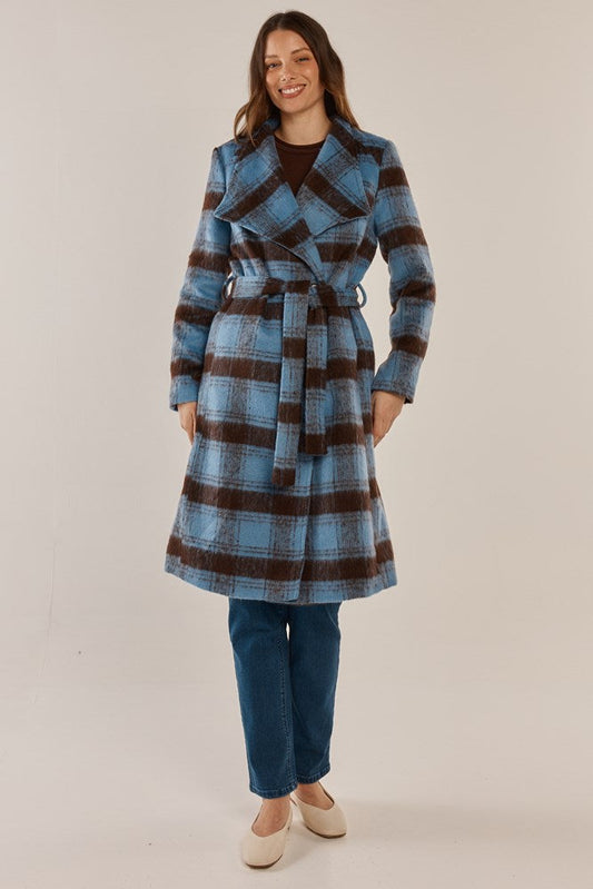 Image of a model wearing Outerwear. Product name - Britney Coat Blue/Chocolate Check in Blue/Chocolate Check colour by brand - Betty Basics