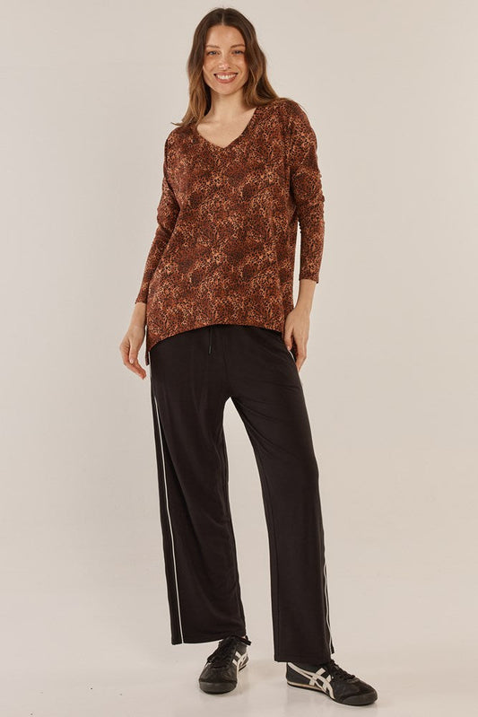 Image of a model wearing Pants. Productname: Betty Basics Evelyn Wide Leg Jogger Black/White in Black/White colour by brand - Betty Basics