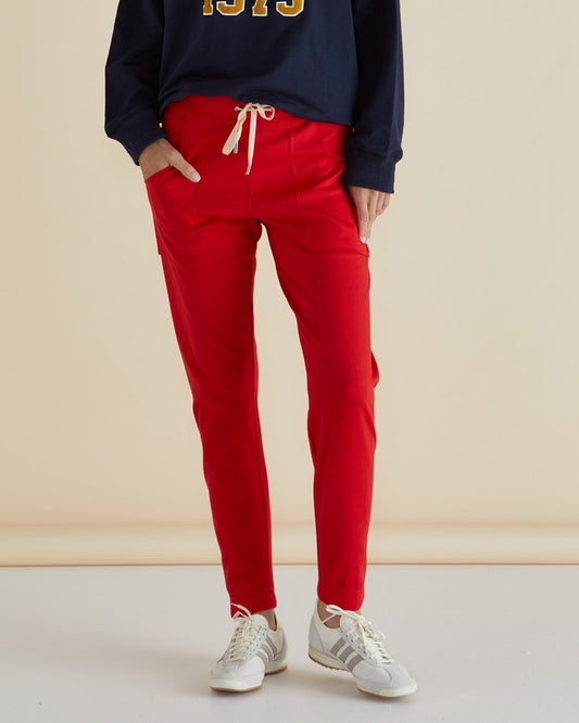 Image of a model wearing Pants. Productname: Betty Basics Noelle Jogger Red in Red colour by brand - Betty Basics