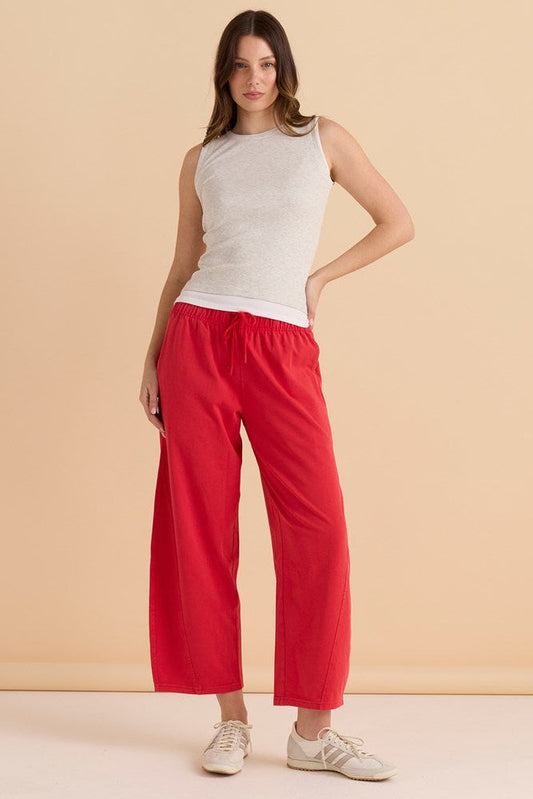 Image of a model wearing Pants. Productname: Betty Basics Barrel Leg Sweatpant Red in Red colour by brand - Betty Basics