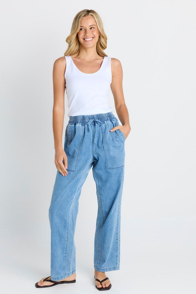 Image of a model wearing Pants. Product name - Quinn Cotton Jogger Blue Medium in Blue Medium colour by brand - Betty Basics