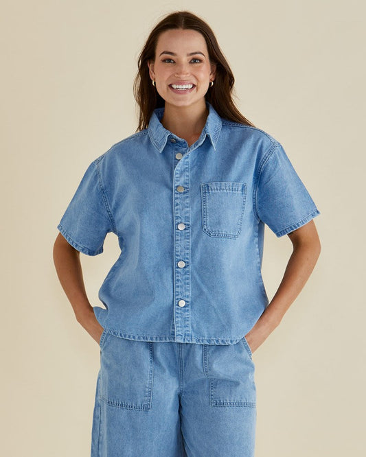 Image of a model wearing Tops. Productname: Betty Basics Saffra Short Sleeve Denim Shirt Medium Wash in Medium Wash colour by brand - Betty Basics