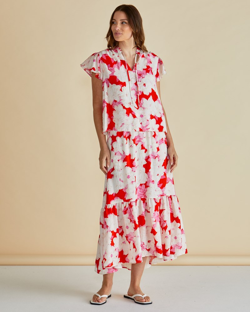Image of a model wearing Skirts. Productname: Betty Basics Maggie Skirt Red Floral Print in Red Floral Print colour by brand - Betty Basics