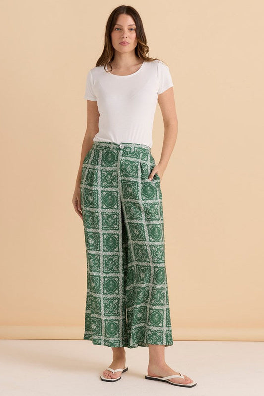 Image of a model wearing Pants. Productname: Betty Basics Pearl Palazzo Pant Floral Tile Print in Floral Tile Print colour by brand - Betty Basics
