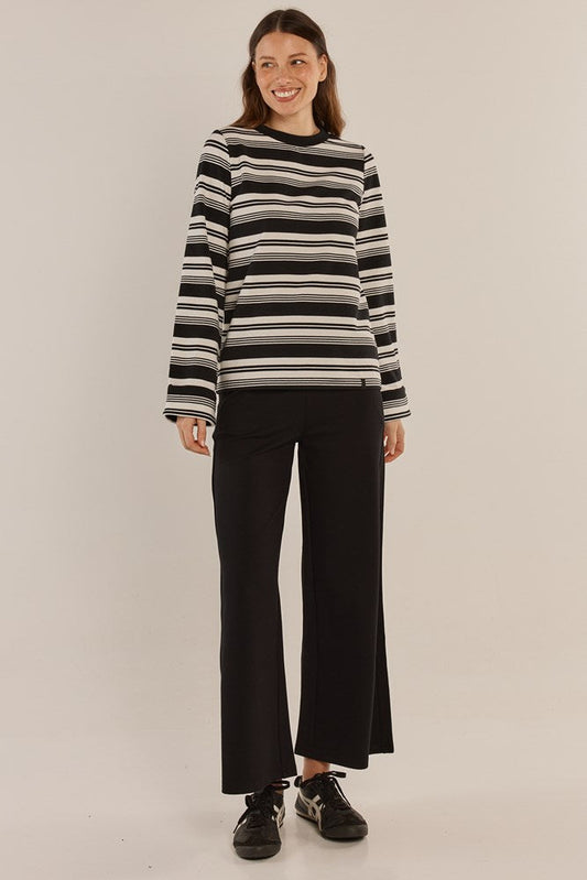 Image of a model wearing Pants. Productname: Betty Basics Wynn Wide Leg Ponte Pant Black in Black colour by brand - Betty Basics