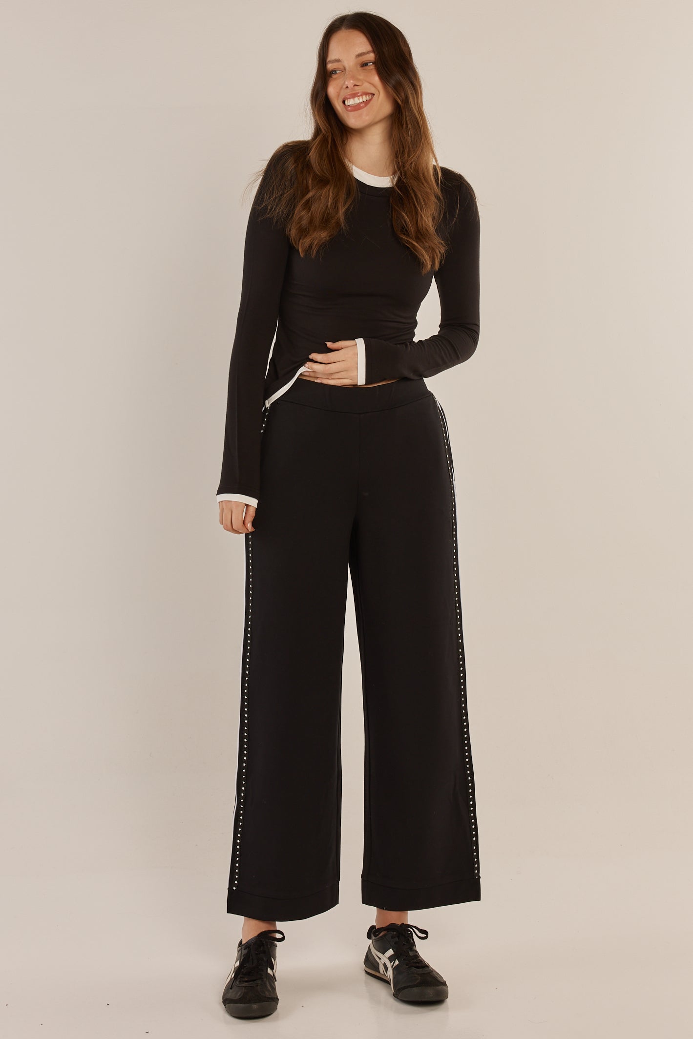 Image of a model wearing Pants. Product name - Bien Ponte Jogger Black/White in Black/White colour by brand - Betty Basics