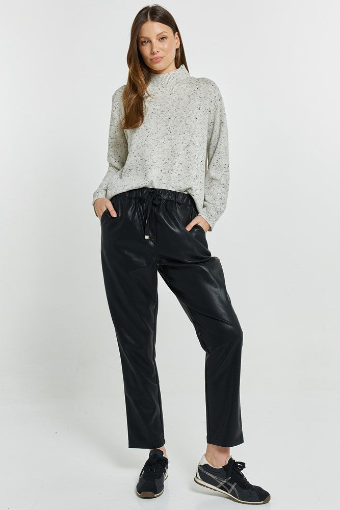 Image of a model wearing Pants. Product name - Poppy PU Jogger Black PU in Black Pu colour by brand - Betty Basics