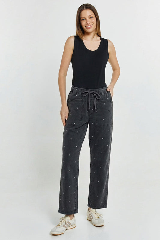 Image of a model wearing Pants. Productname: Quinn Stretch Jogger Star Print in Star Print colour by brand - Betty Basics