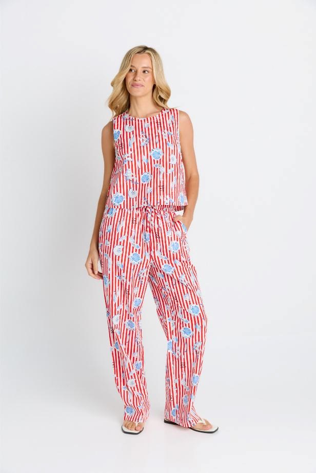Image of a model wearing Pants. Product name - Amalfi Pant in Amalfi Print colour by brand - Betty Basics