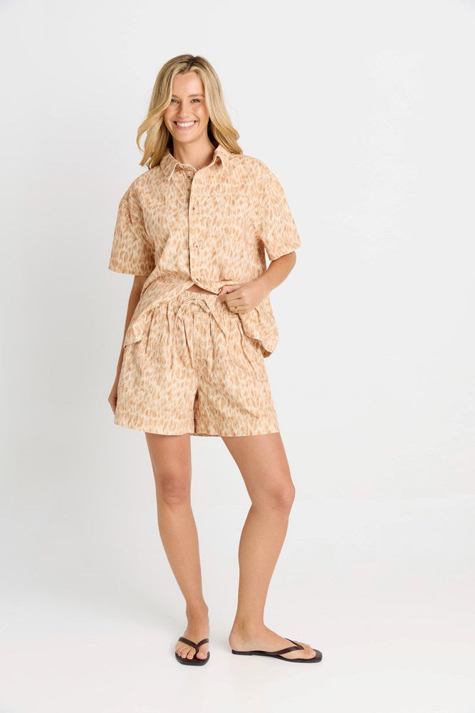 Image of a model wearing Shorts. Product name - Quinn Cotton Short in Ocelot Print colour by brand - Betty Basics