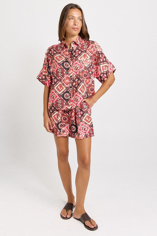 Image of a model wearing Shorts. Product name - Solstice Relaxed Short Coco Print in Coco Print colour by brand - Betty Basics
