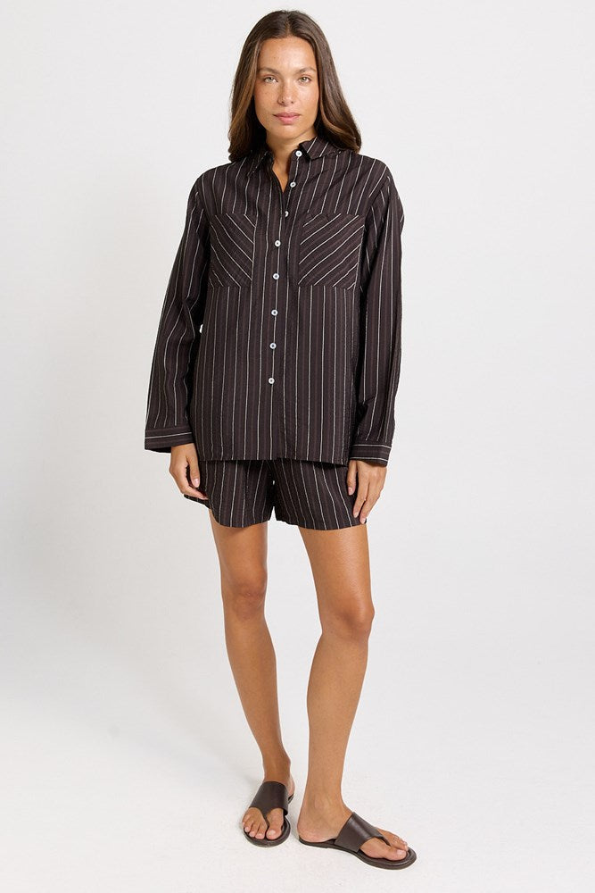 Image of a model wearing Shorts. Product name - Sorrento Relaxed Short Brown Stripe in Brown Stripe colour by brand - Betty Basics