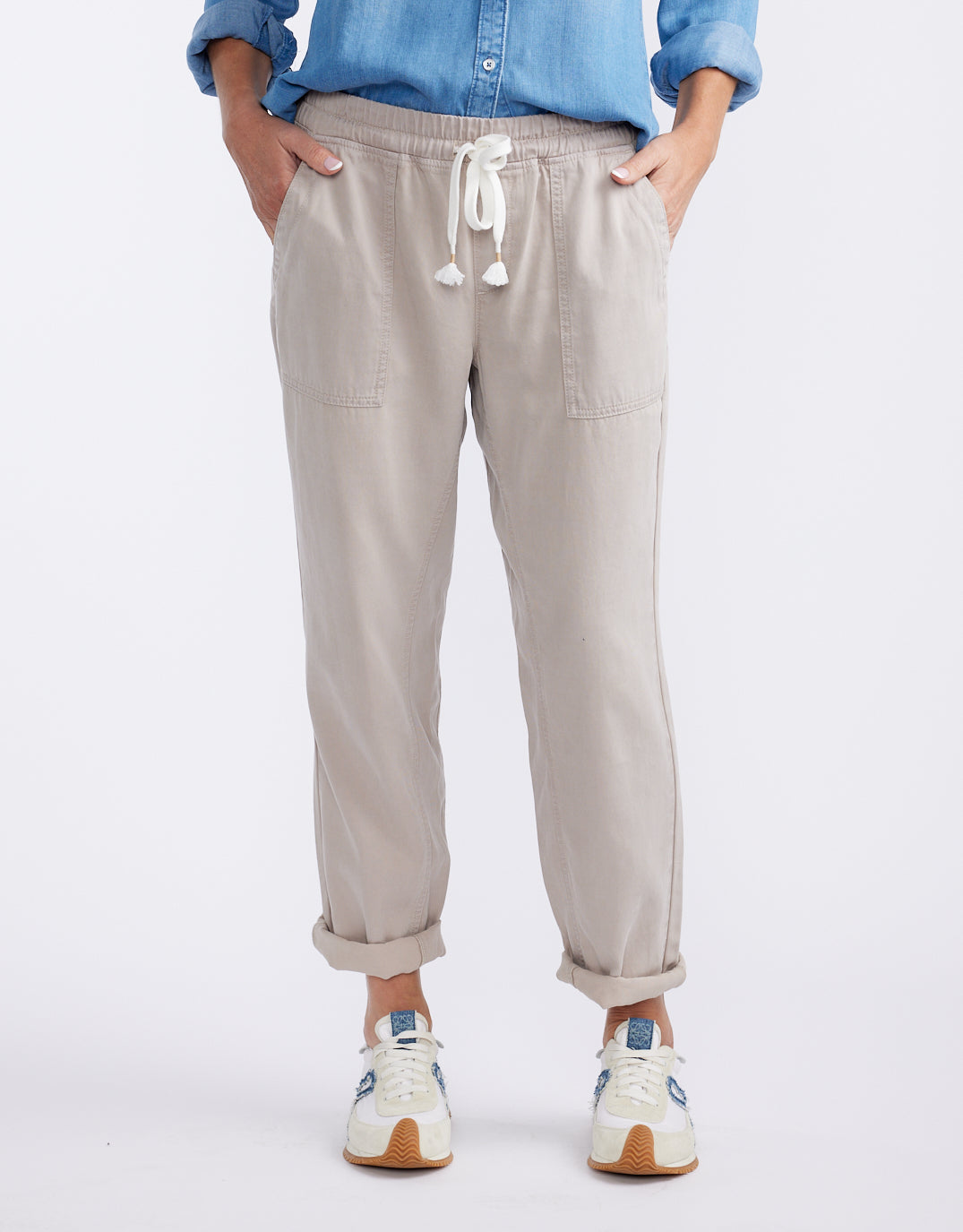 Image of a model wearing Pants. Product name - Beach Comber Pant Stone in Stone colour by brand - White & Co.