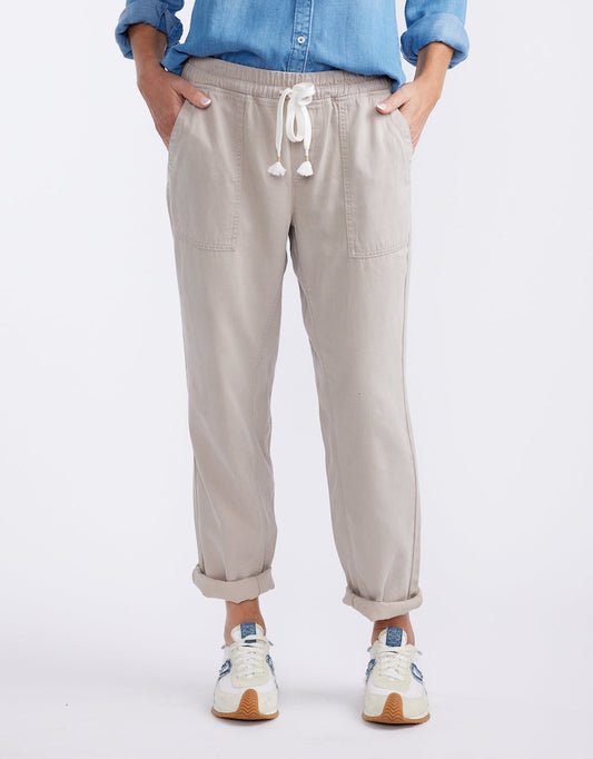 Image of a model wearing Pants. Product name - Beach Comber Pant Stone in Stone colour by brand - White & Co.