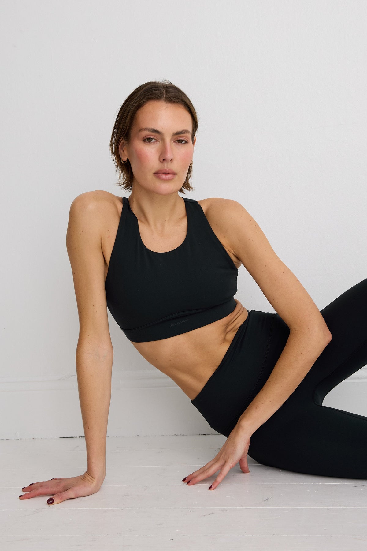 Image of Activewear. Product name - NEW ALLFENIX CloudCore High Neck Racer Sports Bra in Black colour by brand - All Fenix