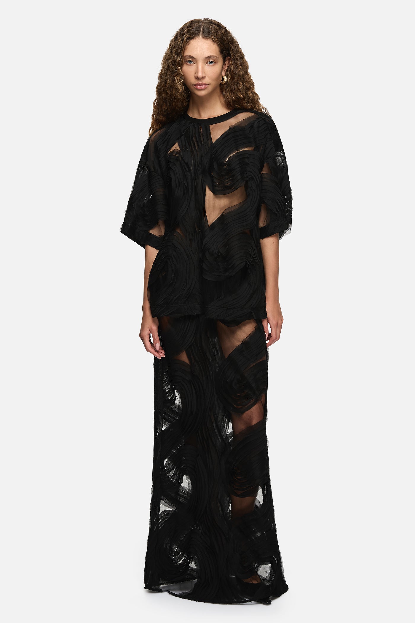 Image of a model wearing Tops. Product name - Delmare Top Black in Black colour by brand - Blanca Studio