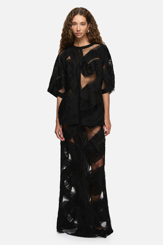 Image of a model wearing Tops. Product name - Delmare Top Black in Black colour by brand - Blanca Studio