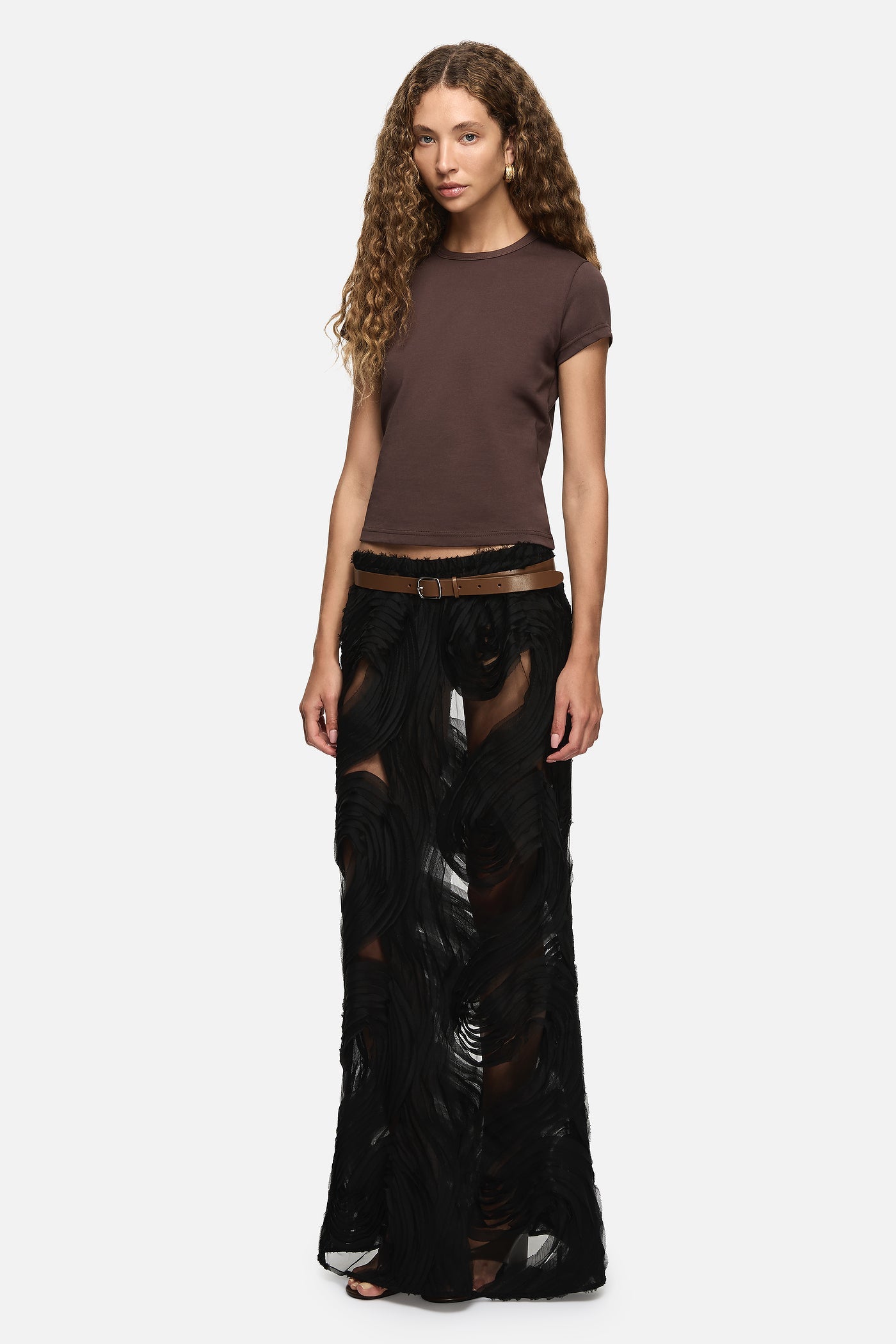 Image of a model wearing Skirts. Product name - Delmare Skirt Black in Black colour by brand - Blanca Studio