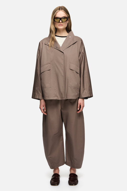 Image of a model wearing Pants. Product name - Freda Pants Taupe in Taupe colour by brand - Blanca Studio