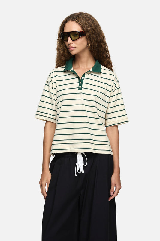 Image of a model wearing Tops. Product name - Natalini Polo Green in Green colour by brand - Blanca Studio