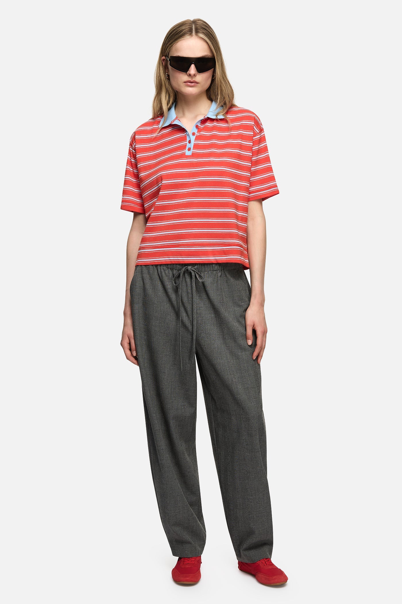 Image of a model wearing Tops. Product name - Natalini Polo Red in Red colour by brand - Blanca Studio