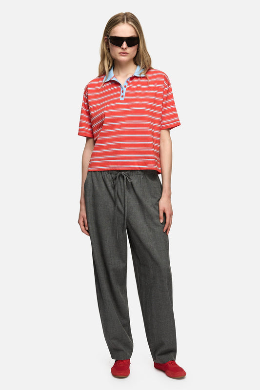 Image of a model wearing Tops. Product name - Natalini Polo Red in Red colour by brand - Blanca Studio