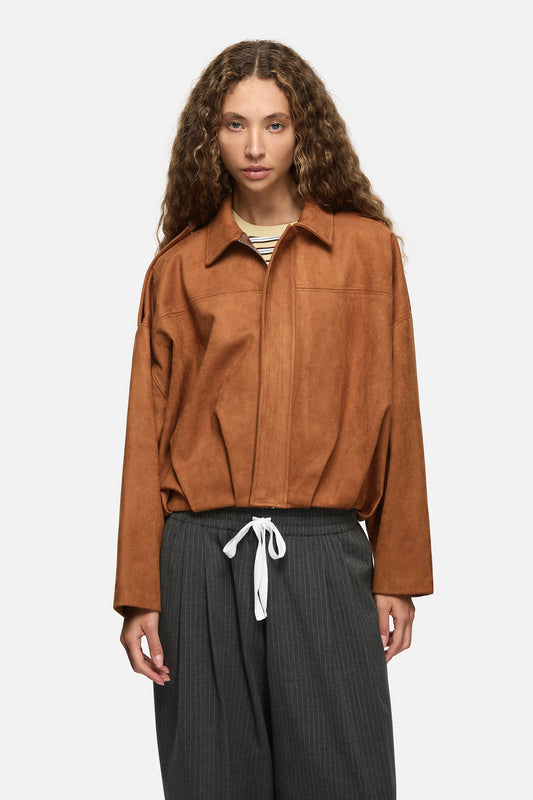 Image of a model wearing Outerwear. Product name - Rita Bomber Tan in Tan colour by brand - Blanca Studio