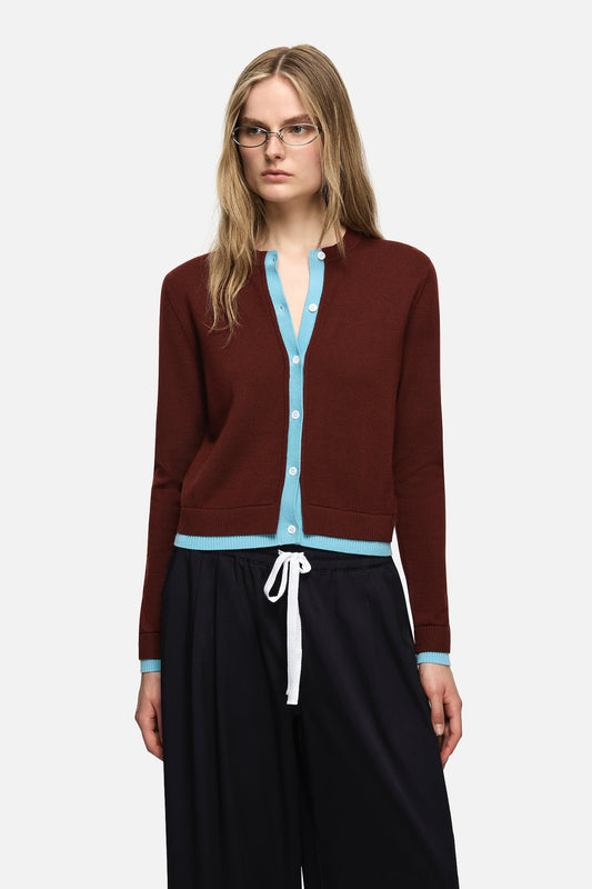 Image of a model wearing Outerwear. Product name - Roy Cardigan Brown in Brown colour by brand - Blanca Studio
