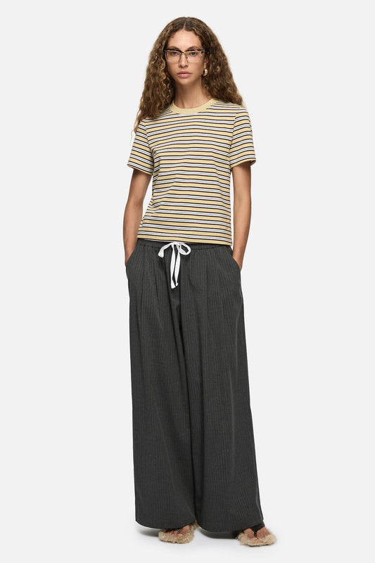 Image of a model wearing Pants. Product name - Mavis Trousers Charcoal in Charcoal colour by brand - Blanca Studio