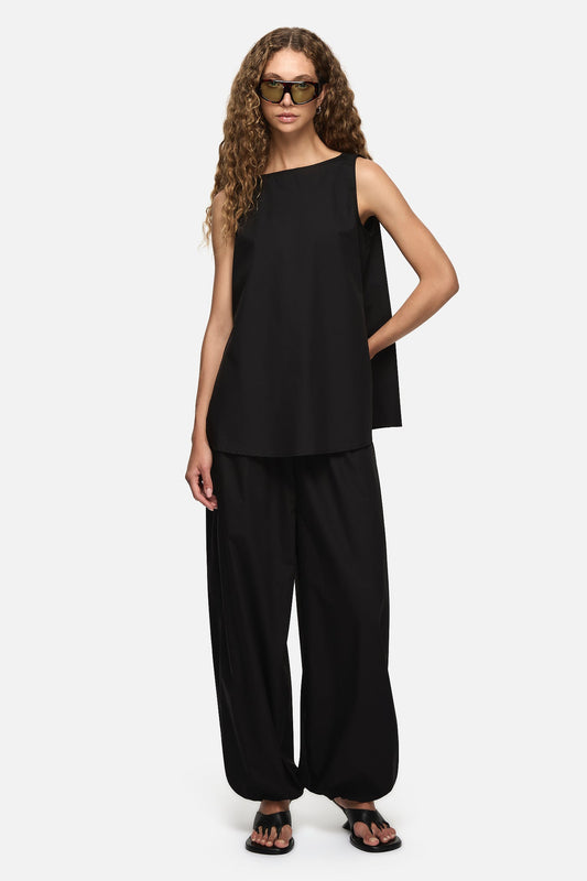 Image of a model wearing Tops. Product name - Yan Top Black in Black colour by brand - Blanca Studio