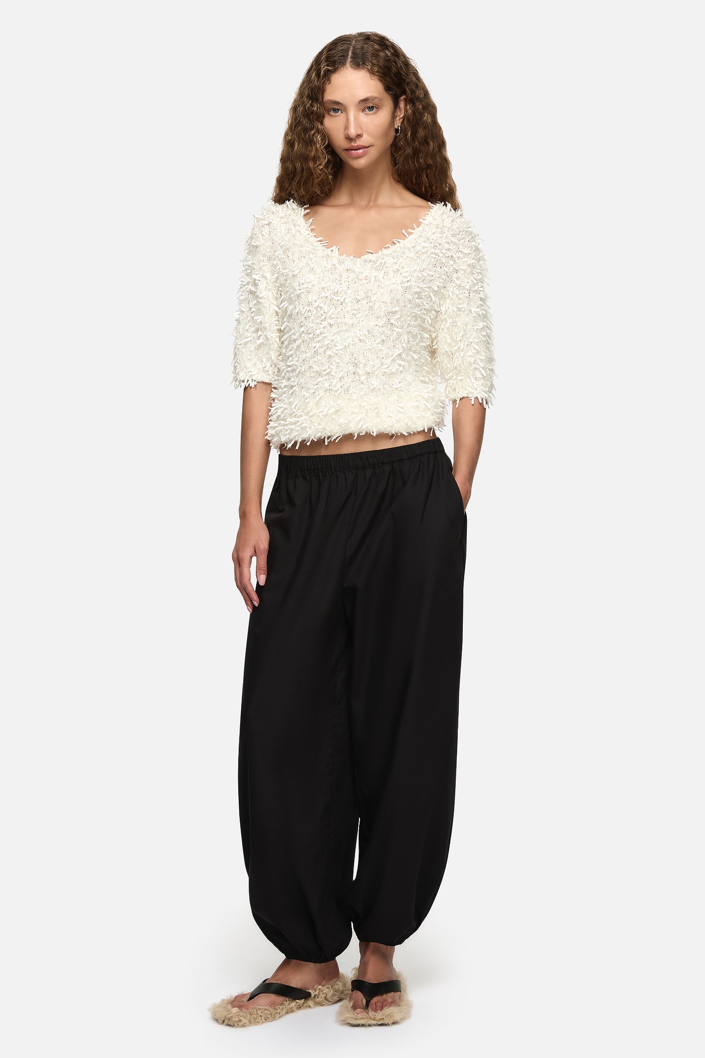 Image of a model wearing Tops. Product name - Harmonia Top Cream in Cream colour by brand - Blanca Studio