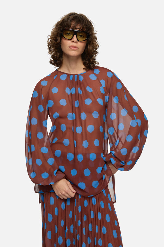Image of a model wearing Tops. Product name - Domenica Top Brown in Brown colour by brand - Blanca Studio