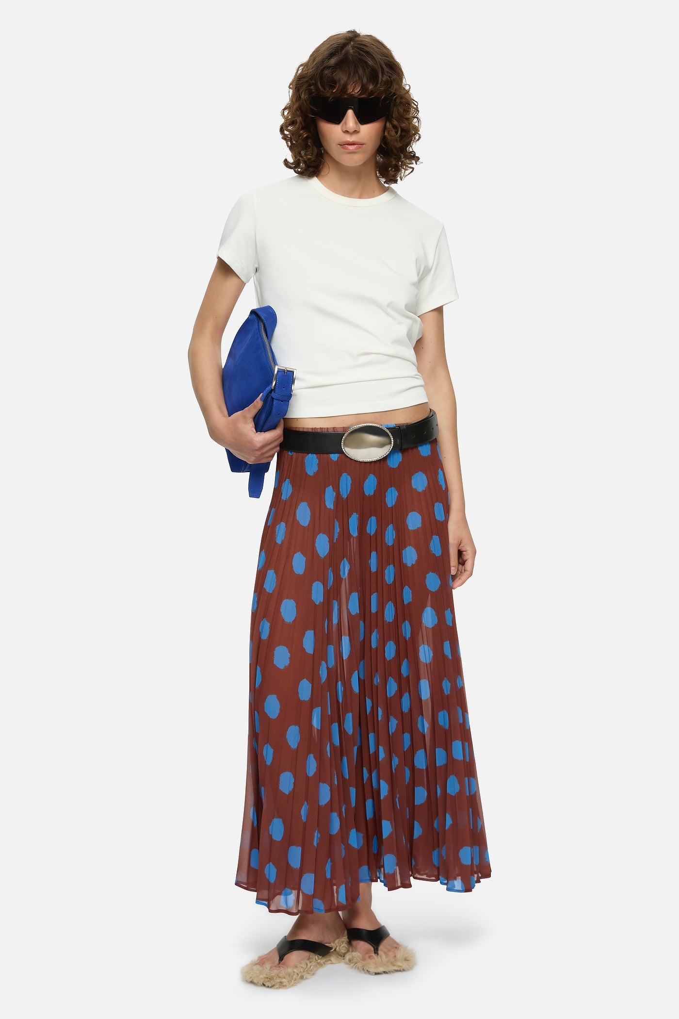 Image of a model wearing Skirts. Product name - Domenica Skirt Brown in Brown colour by brand - Blanca Studio