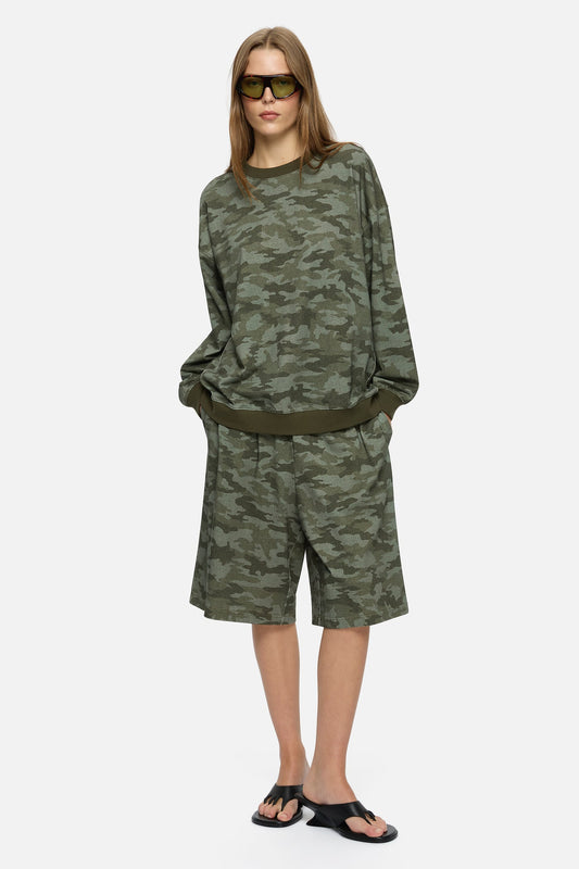 Image of a model wearing Shorts. Product name - Indi Shorts Khaki in Khaki colour by brand - Blanca Studio