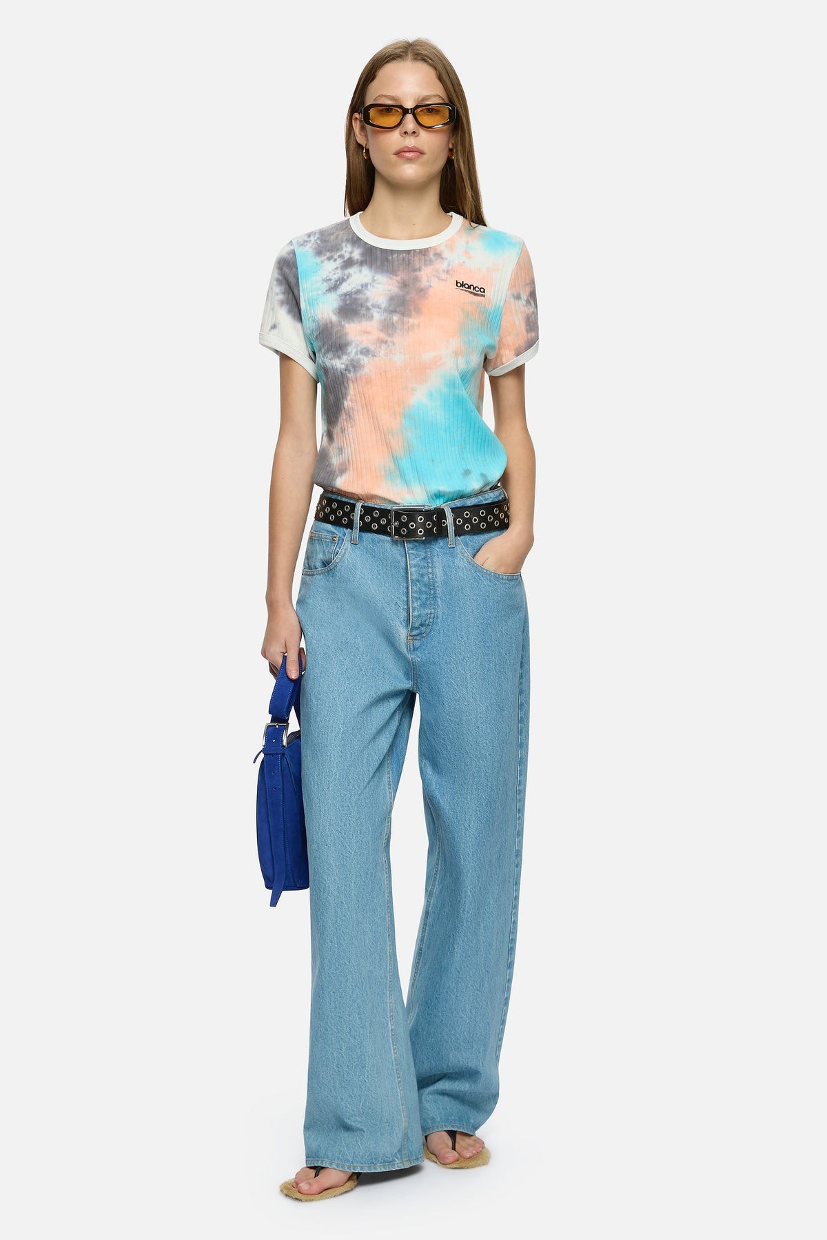 Image of a model wearing Tops. Product name - Isola Tee Blue in Blue colour by brand - Blanca Studio