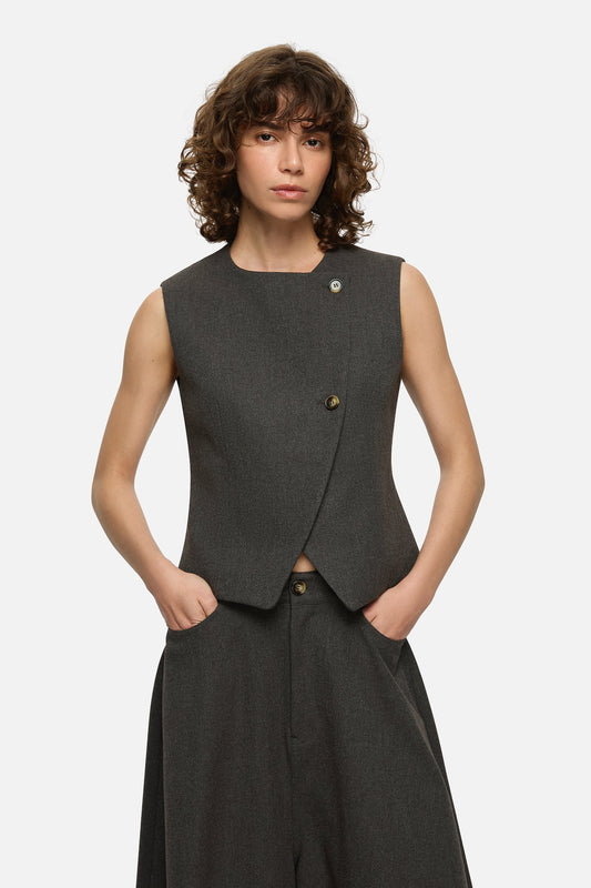 Image of a model wearing Tops. Product name - Jasmine Vest Charcoal in Charcoal colour by brand - Blanca Studio