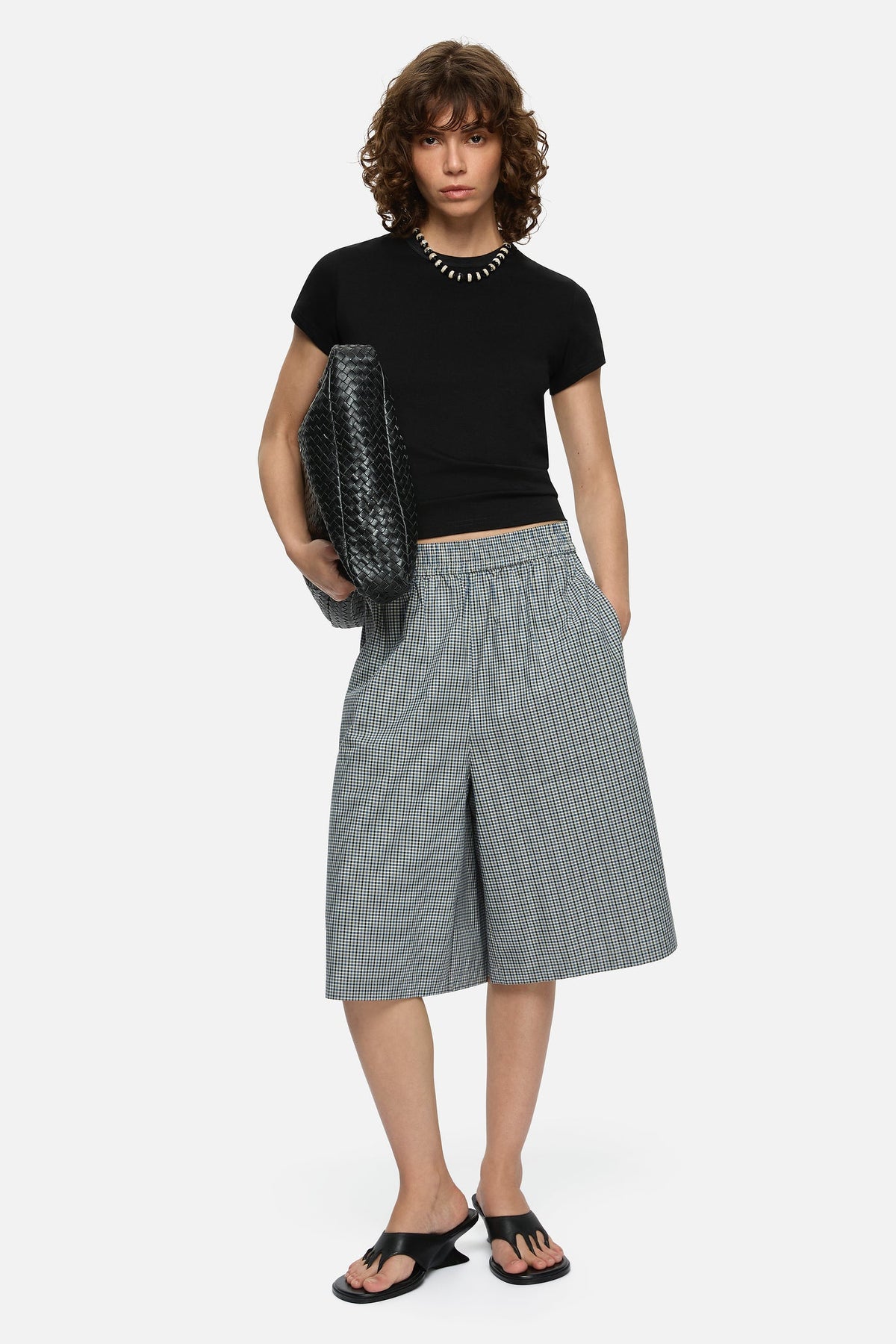 Image of a model wearing Shorts. Product name - Laurel Shorts Blue in Blue colour by brand - Blanca Studio