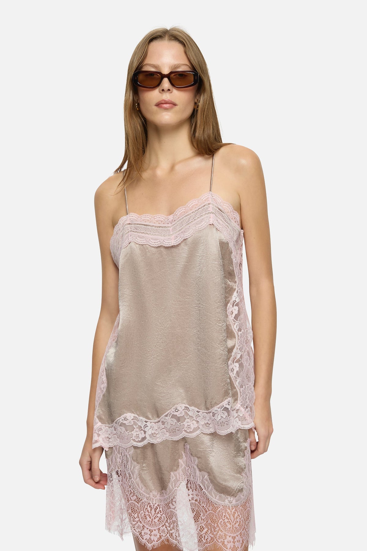 Image of a model wearing Tops. Product name - Lily Top Grey in Grey colour by brand - Blanca Studio