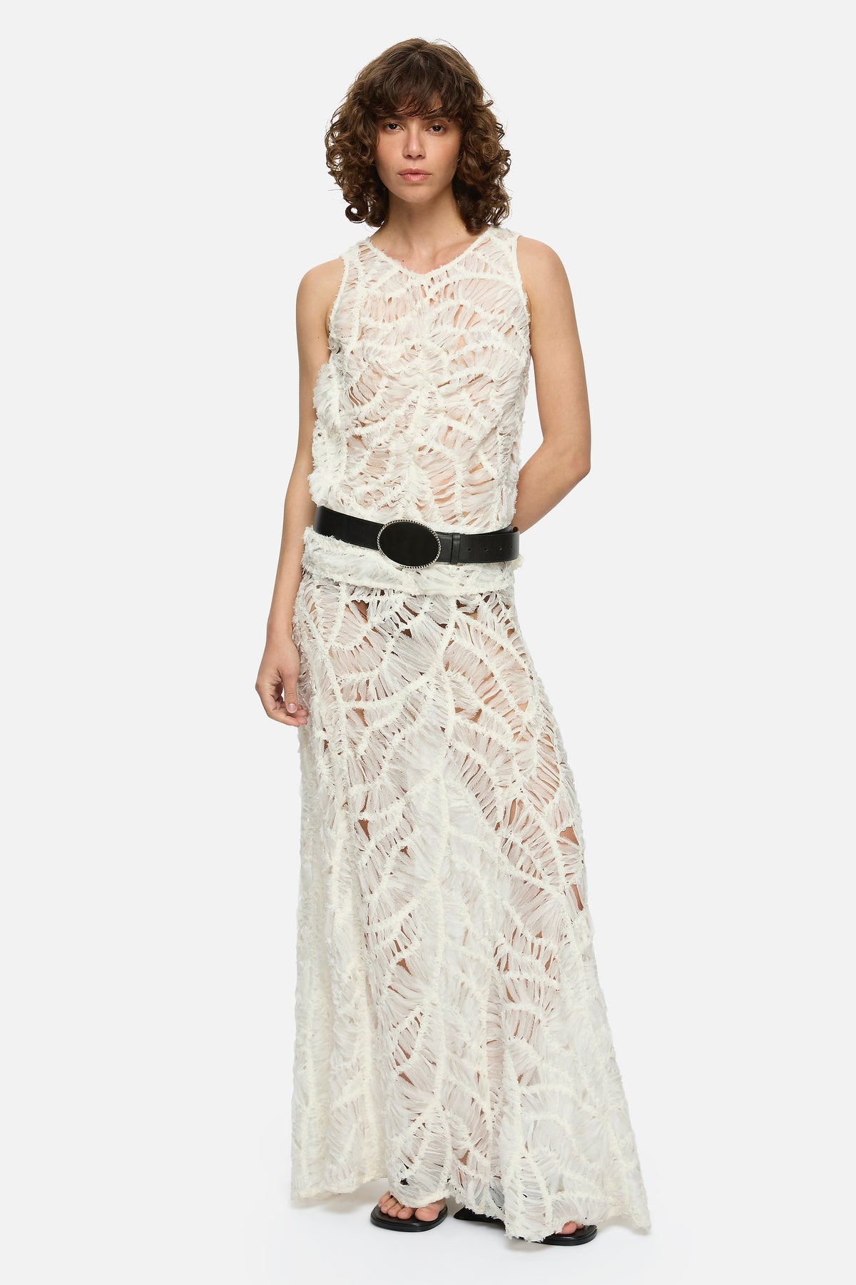 Image of a model wearing Skirts. Product name - Liore Skirt Cream in Cream colour by brand - Blanca Studio
