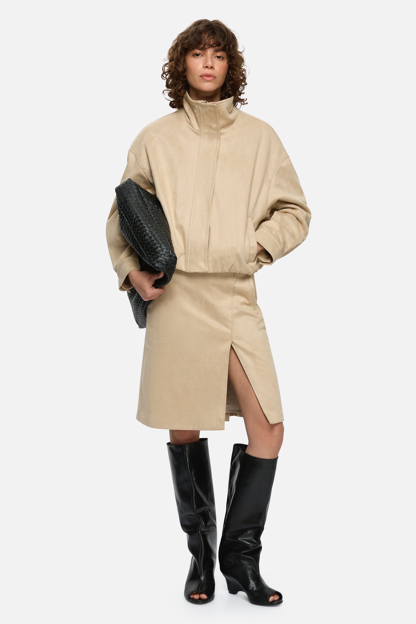 Image of a model wearing Skirts. Product name - Matisse Skirt Beige in Beige colour by brand - Blanca Studio