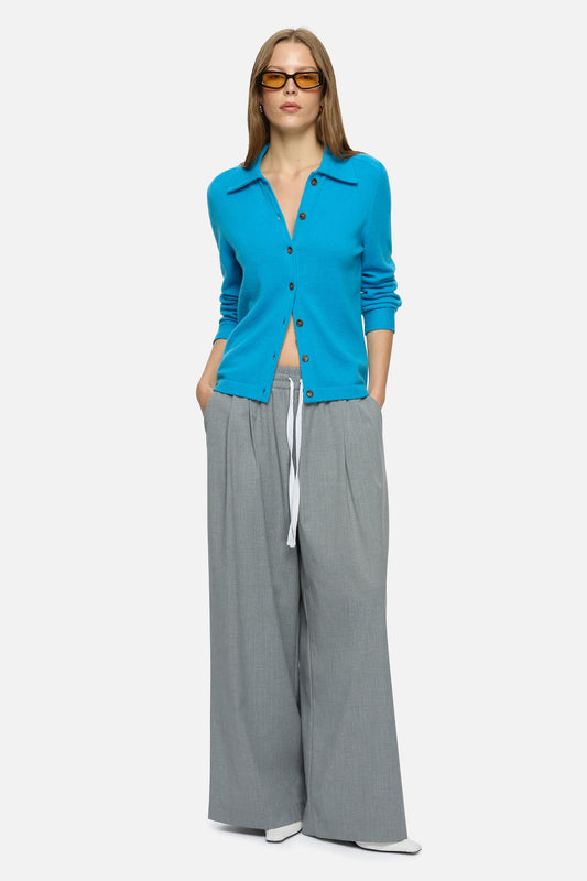 Image of a model wearing Outerwear. Product name - Rumi Cardigan Blue in Blue colour by brand - Blanca Studio