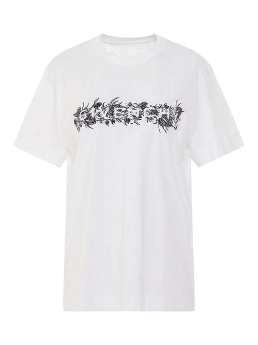 Image of a model wearing Tops. Productname: GIVENCHY 4G Embroidered Logo Thistle T-Shirt in White colour by brand - GIVENCHY