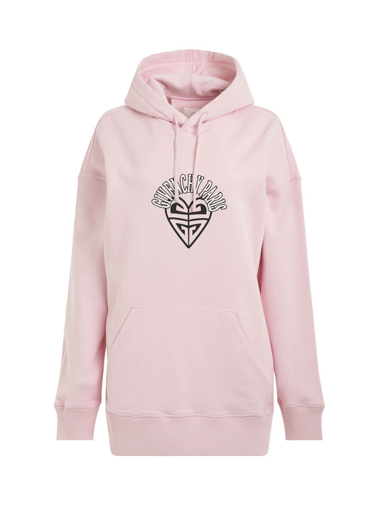 Image of a model wearing Outerwear. Productname: GIVENCHY Disney Oswald Paris Hoodie in Light Pink colour by brand - GIVENCHY