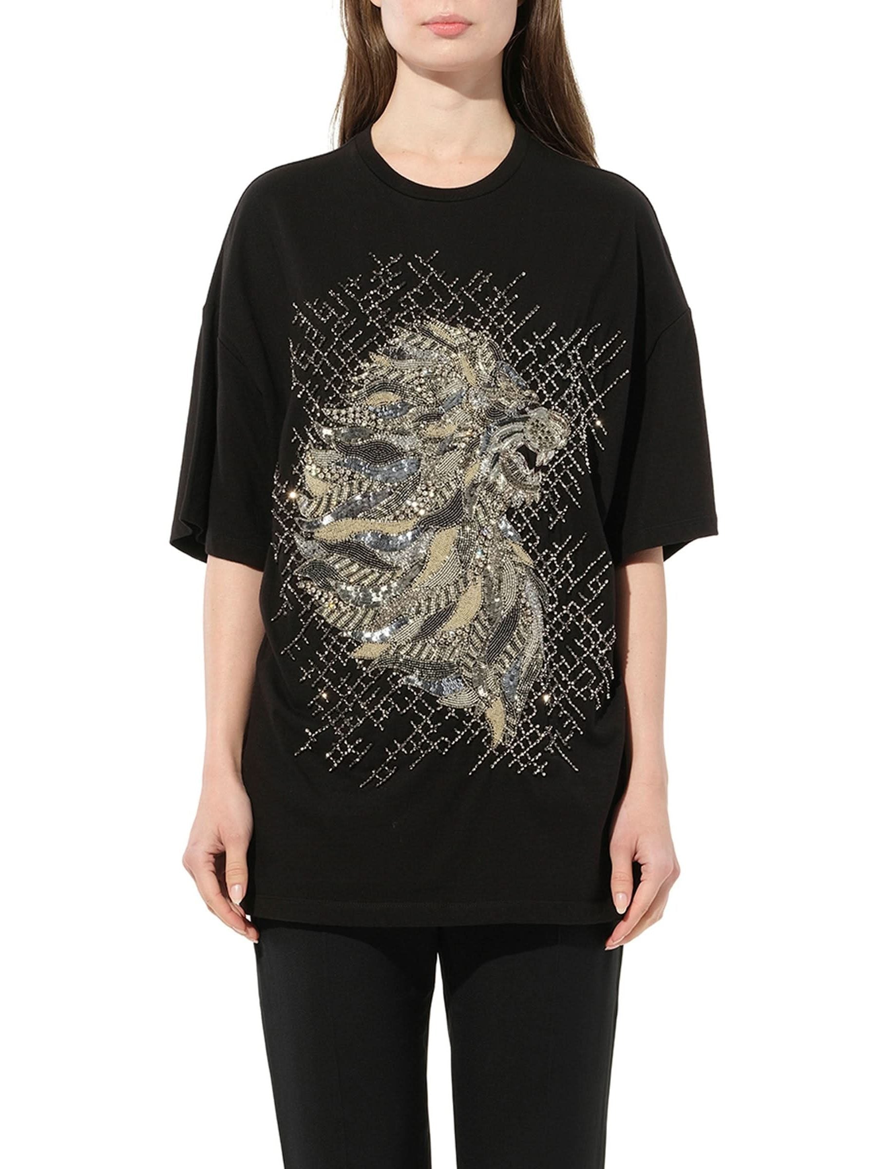 Image of a model wearing Tops. Productname: BALMAIN Lion Jewel T-Shirt in Black colour by brand - BALMAIN