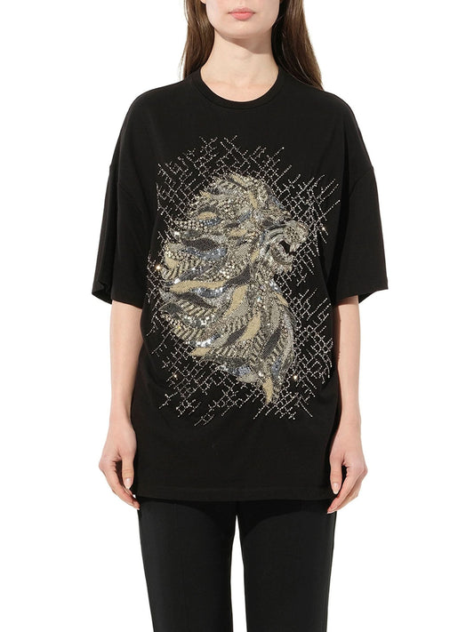 Image of a model wearing Tops. Productname: BALMAIN Lion Jewel T-Shirt in Black colour by brand - BALMAIN