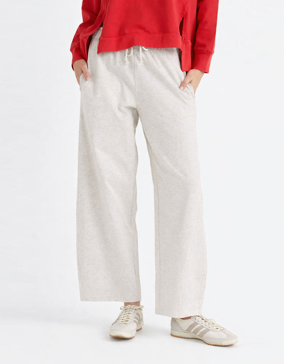 Image of a model wearing Pants. Product name - Barrel Leg Sweatpant Grey Marle in Grey Marle colour by brand - Betty Basics