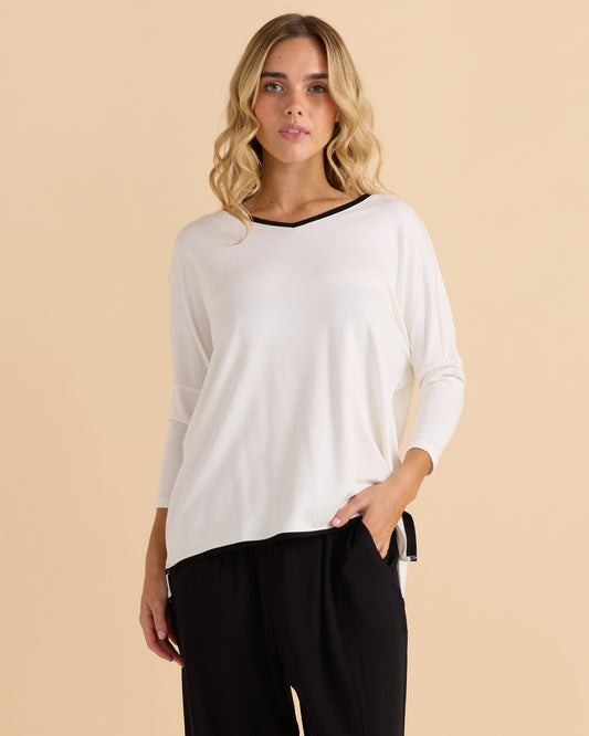 Image of a model wearing Tops. Productname: Betty Basics Adina 3/4 Sleeve Top White in White colour by brand - Betty Basics
