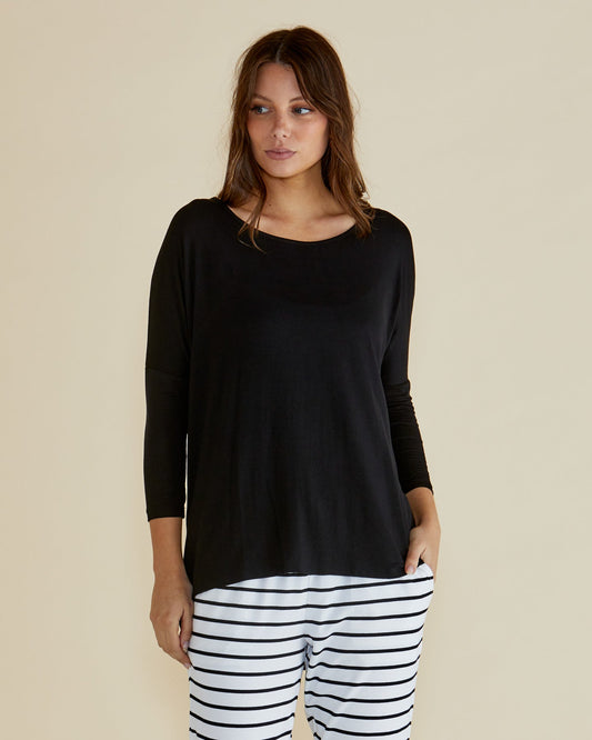 Image of a model wearing Tops. Productname: Betty Basics Milan 3/4 Sleeve Top Black in Black colour by brand - Betty Basics